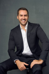 Relaxed smiling headshot photography in studio