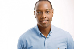 male casual headshot on white background wearing a light blue shirt by arielle lewis studios photographer in washington DC