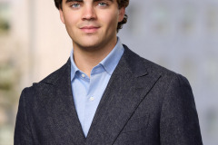 Professional Speaker headshot with a natural background