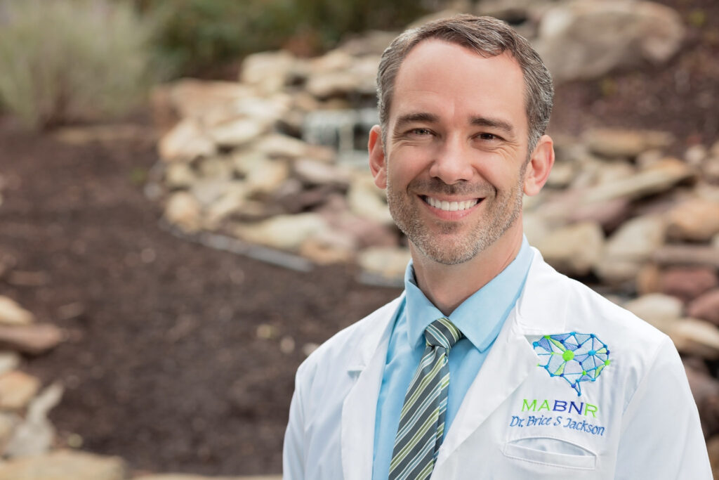 male doctor headshot outdoors in white suit jacket with natural light by Arielle Lewis Studio in washington DC