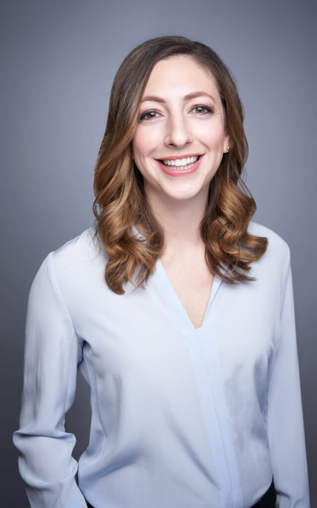 modern headshot on grey background with white dress shirt in studio